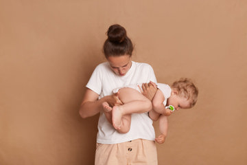Mom checking if baby has a diarrea